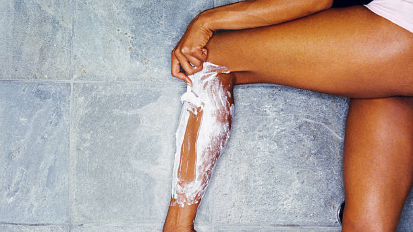 Woman shaving legs with ingrown hair